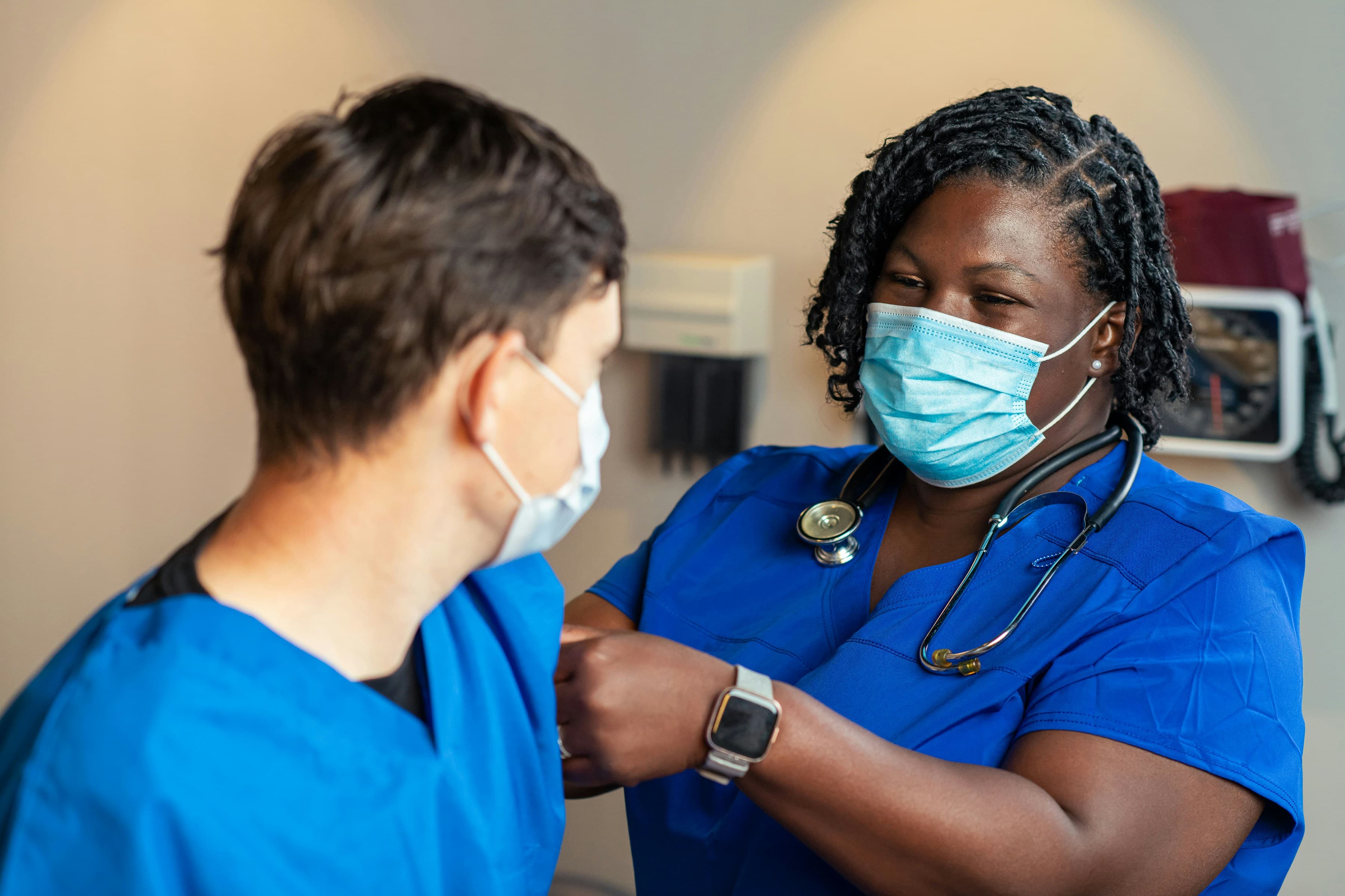 A nurse attending to a patient (stock placeholder photo, pending real photography from Aruna Memorial Hospital)